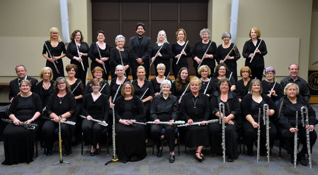 Flute choir gathered in black concert attire